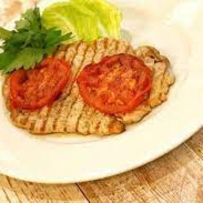 Эскалоп из свинины  с помидорами