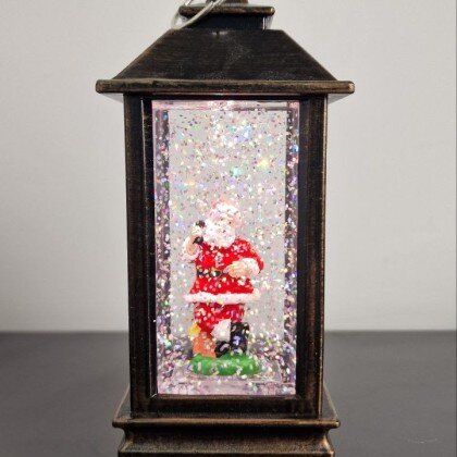 Новогодний декоративный фонарь с эффектом снегопада.